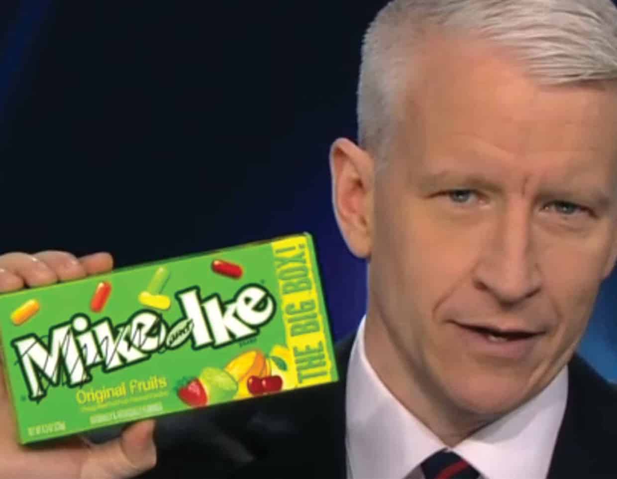 anderson cooper holding up a box of Mike and Ike's brand candy on live news show
