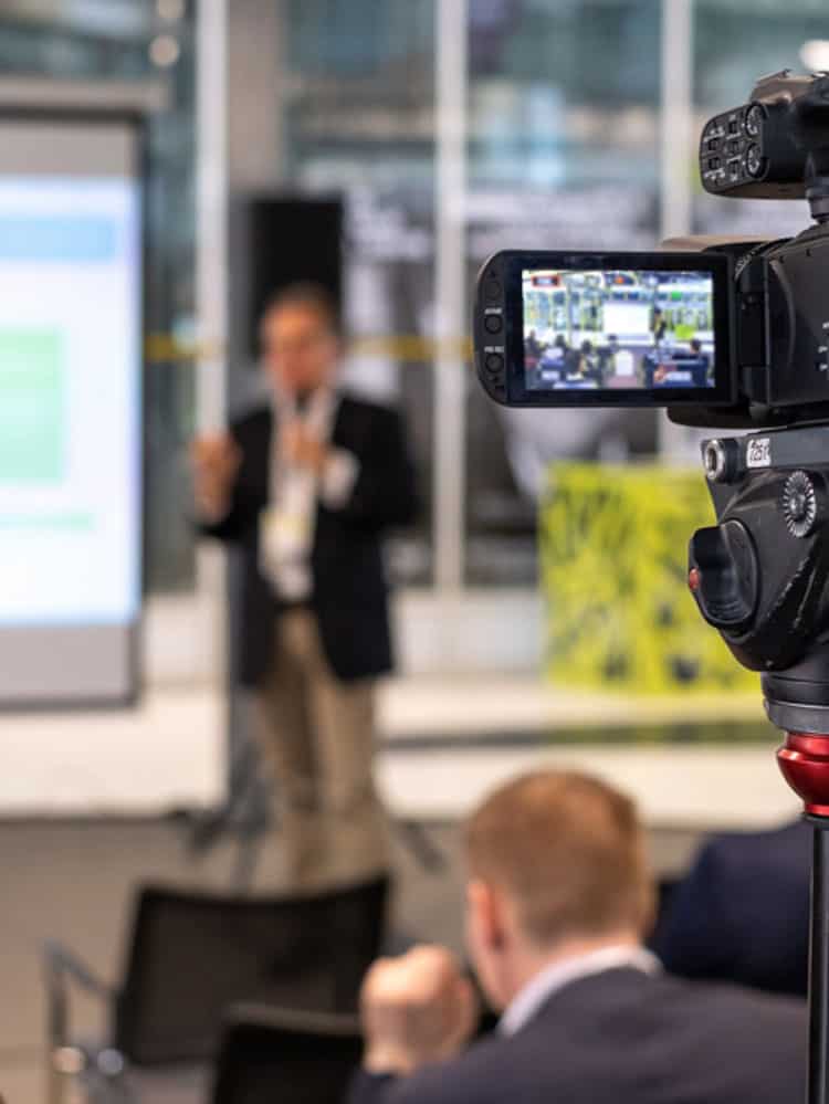 corporate presentation pr event being captured on video camera