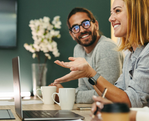 public relations team discussing pr plan for client in conference room