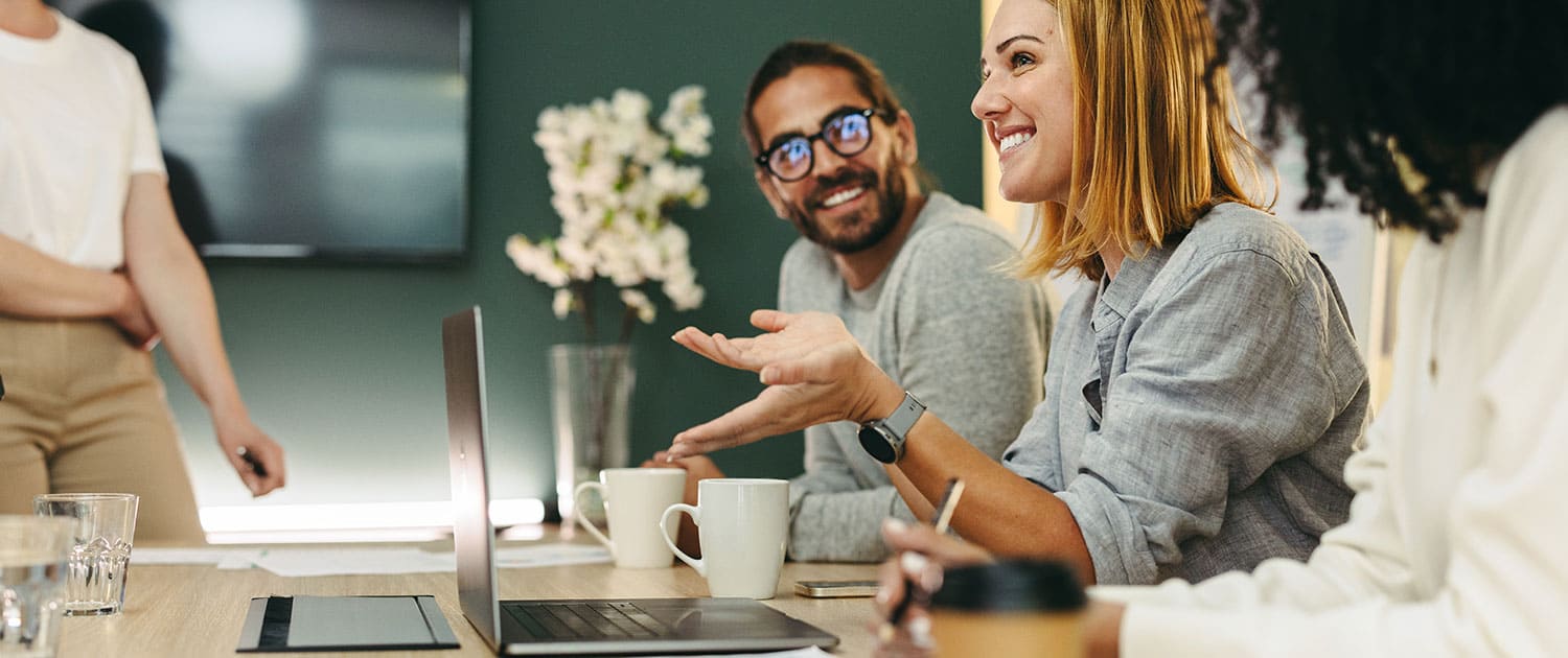 public relations team discussing pr plan for client in conference room