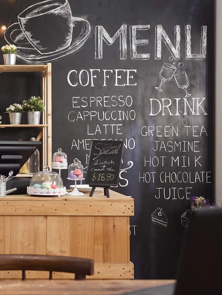 inside of cozy coffee shop with view of chalkboard menu