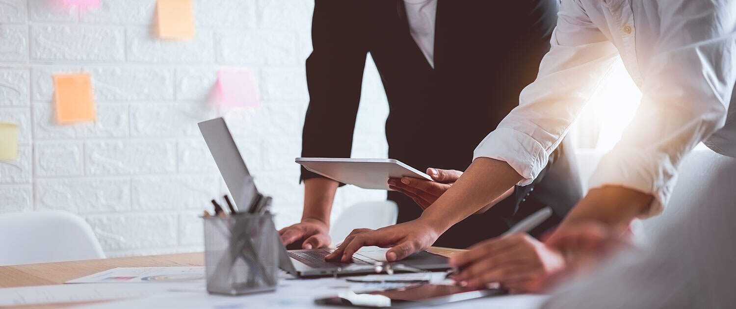 journalists in modern office working on pr strategy at computer