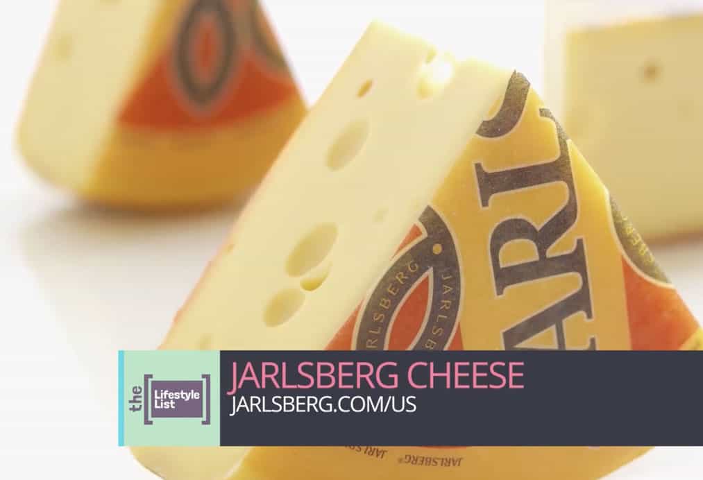 jarlsberg cheese cut into wedges in web commercial