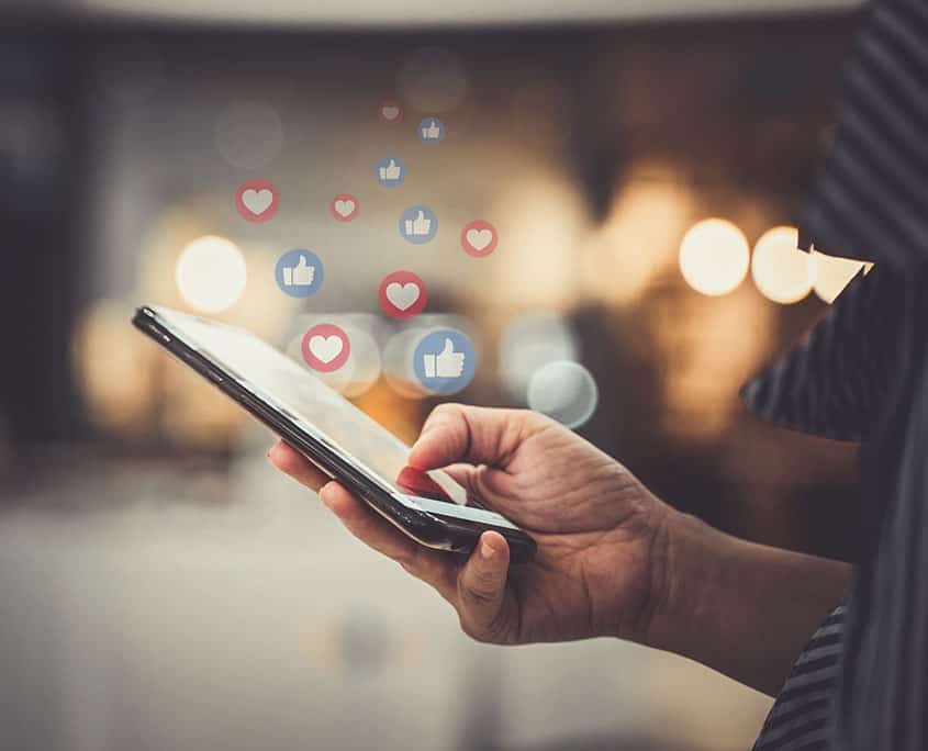 brand owner responding to social media alerts on their phone