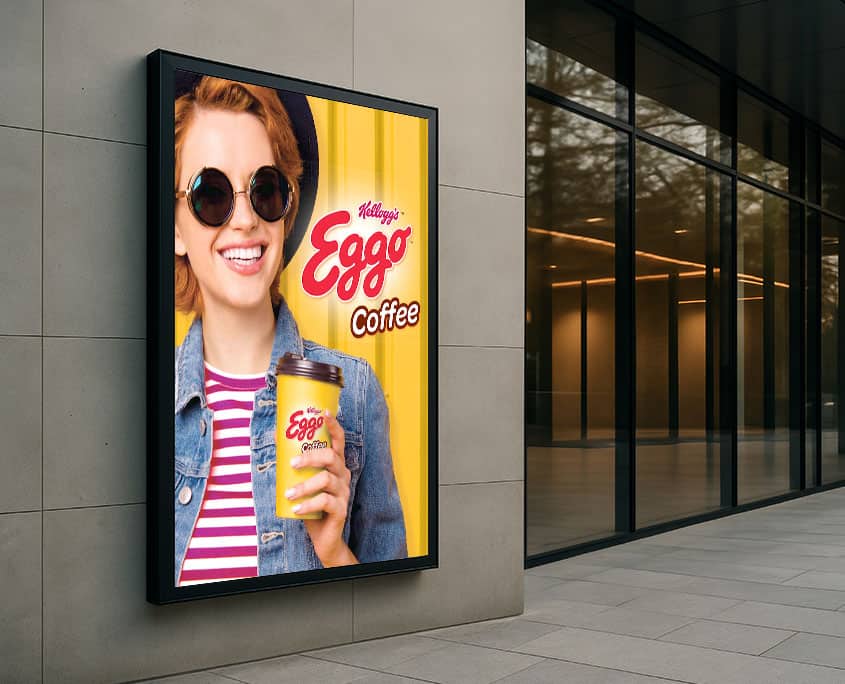 media placement in city using Eggo Coffee advertisement with hip woman holding Kellogg's Eggo Coffee cup for pr campaign photo shoot
