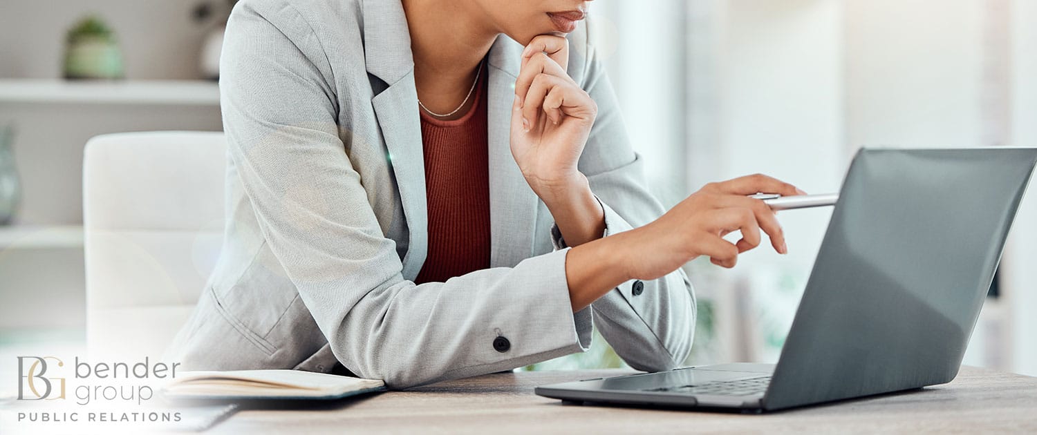 woman working on computer in pr agency office