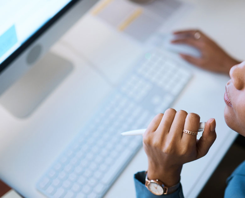 pr expert working on press release on computer in office