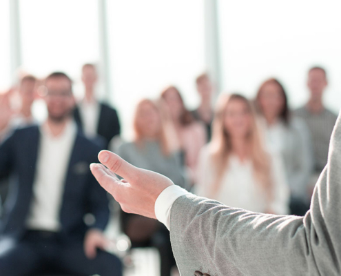 Corporate businessman presenting at leadership retreat seminar