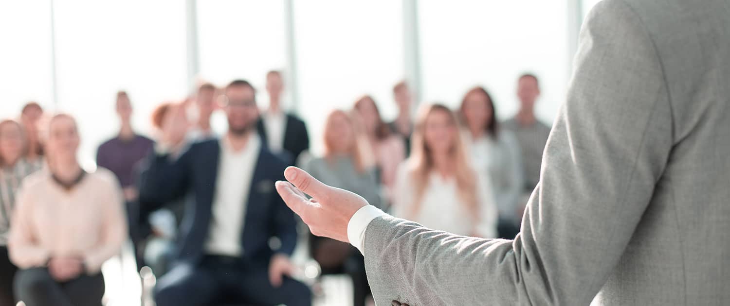 Corporate businessman presenting at leadership retreat seminar